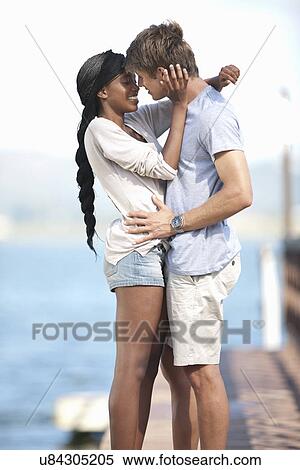 Young couple embracing View Large Photo Image Stock Photography - Young couple embracing. Fotosearch