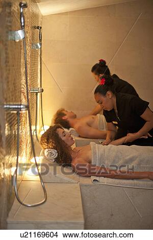 Picture - Young couple having a massage in spa. Fotosearch