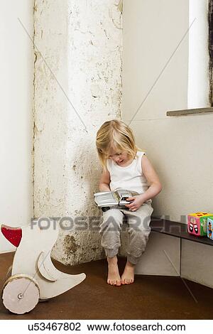 Young girl playing with toy car in corridor View Large Photo Image Stock Image - Young girl playing with toy car in corridor. Fotosearch
