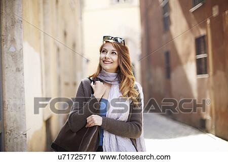 Stock Photo - Young sophisticated woman exploring streets, Rome, Italy. Fotosearch
