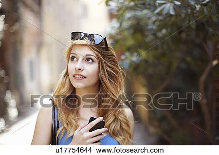 Young woman exploring quaint street, Rome, Italy View Large Photo Image Picture - Young woman exploring quaint street, Rome, Italy. Fotosearch