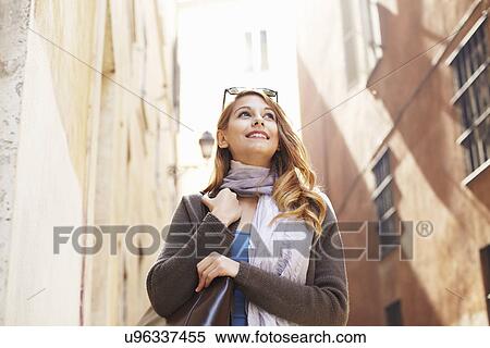 Stock Photography - Young woman exploring streets, Rome, Italy. Fotosearch