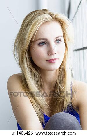 Stock Photography - Young woman in gymnasium, portrait. Fotosearch