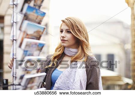 Young woman looking at postcards, Rome, Italy View Large Photo Image Stock Photograph - Young woman looking at postcards, Rome, Italy. Fotosearch