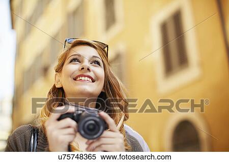 Young woman with digital camera, Rome, Italy View Large Photo Image Stock Photography - Young woman with digital camera, Rome, Italy. Fotosearch