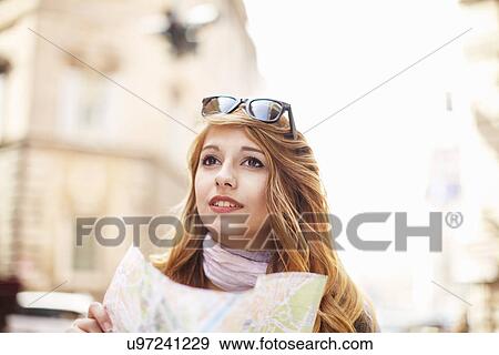Young woman with street map looking lost, Rome, Italy View Large Photo Image Stock Photo - Young woman with street map looking lost, Rome, Italy. Fotosearch