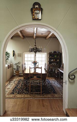 Arched Entrance With Hanging Light Over Dining Table At Home Santa Fe New Mexico USA Arched Entrance With Hanging Light Over Dining Table At Home Santa Fe New Mexico USA