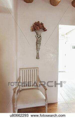 Armchair with vase against the wall at home; Santa Fe; New Mexico; USA View Large Photo Image Stock Image - Armchair with vase against the wall at home; Santa Fe; New Mexico; USA. Fotosearch