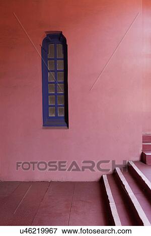 Stock Photo - Blue window on pink wall along stairs; Santa Fe; New Mexico; USA. Fotosearch