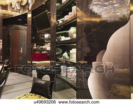 Stock Photograph - Brown cupboard filled with collection of jars. Fotosearch