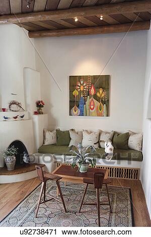 Built in couch with fireplace at home; Santa Fe; New Mexico; USA View Large Photo Image Stock Image - Built in couch with fireplace at home; Santa Fe; New Mexico; USA. Fotosearch