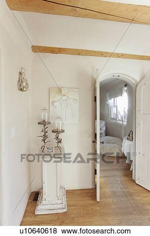 Candle stand besides doorway leading to sitting area at home; Santa Fe; New Mexico; USA View Large Photo Image Stock Photo - Candle stand besides doorway leading to sitting area at home; Santa Fe; New Mexico; USA. Fotosearch