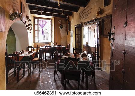 Chairs and tables in a restaurant at Antigua; Guatemala View Large Photo Image Stock Image - Chairs and tables in a restaurant at Antigua; Guatemala. Fotosearch