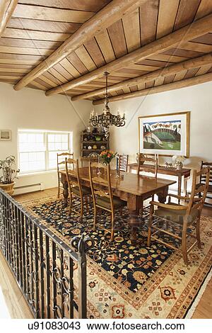 Chandelier Over Dining Table With Wood Paneled Ceiling At Home Santa Fe New Mexico Usa Stock Image