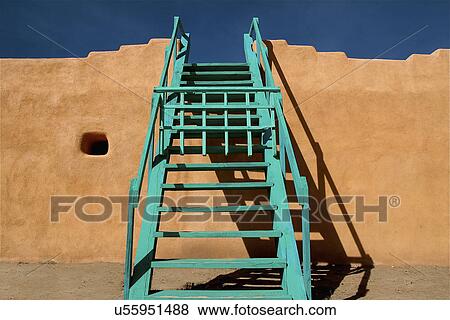 Stock Photo - Classic ceremonial kiva adobe structure with ladder at Santa Clara Pueblo; New Mexico; USA. Fotosearch