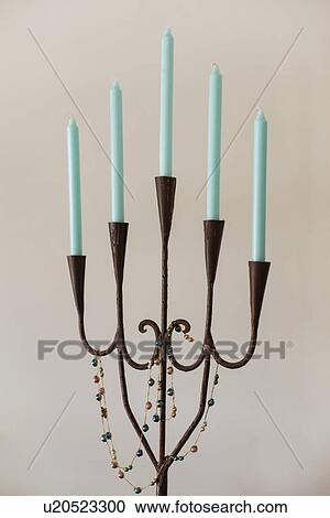 Stock Image - Close-up of candle stand against the wall; Santa Fe; New Mexico; USA. Fotosearch
