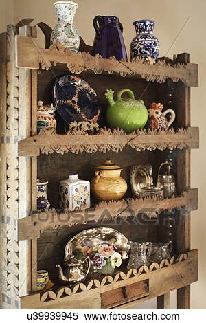 Close-up of centerpieces in shelf at home; Santa Fe; New Mexico; USA View Large Photo Image Stock Photography - Close-up of centerpieces in shelf at home; Santa Fe; New Mexico; USA. Fotosearch