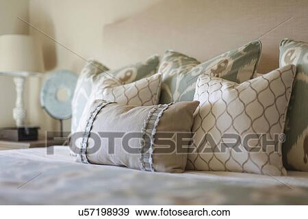 Stock Photo - Close-up of pillows on bed at home; Santa Fe; New Mexico; USA. Fotosearch