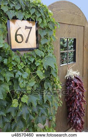 Detail shot of a wall lantern and door number; Santa Fe; New Mexico; USA View Large Photo Image Stock Image - Detail shot of a wall lantern and door number; Santa Fe; New Mexico; USA. Fotosearch