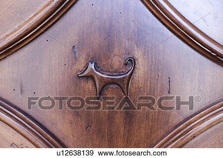 Stock Photo - Detail shot of wooden surface with animal representation; Santa Fe; New Mexico; USA. Fotosearch