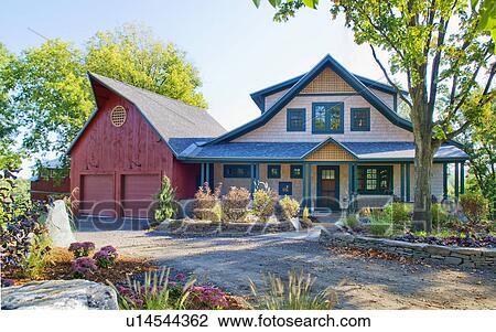 Stock Image - Exterior shot of a house with garage. Fotosearch