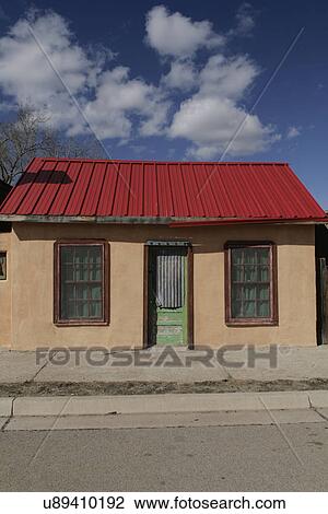 Stock Image - House on the main street against the sky; Carrizozo; New Mexico; USA. Fotosearch