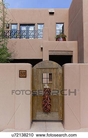 House with traditional chilli ristra hanging on closed entrance door at Santa Fe; New Mexico; USA View Large Photo Image Stock Image - House with traditional chilli ristra hanging on closed entrance door at Santa Fe; New Mexico; USA. Fotosearch
