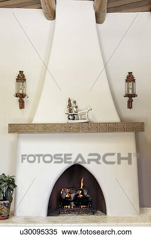 Lit fireplace at home; Santa Fe; New Mexico; USA View Large Photo Image Stock Photography - Lit fireplace at home; Santa Fe; New Mexico; USA. Fotosearch