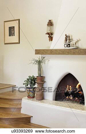 Lit Fireplace With Wooden Stairs At Home Santa Fe New Mexico