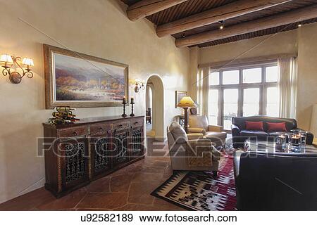 Living Room With Seating Furniture And Wooden Beam Ceiling At Home Santa Fe New Mexico Usa Stock Photo