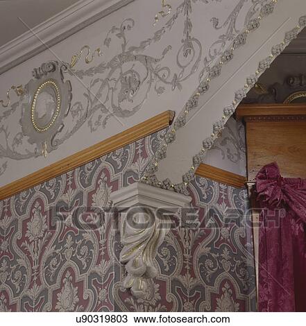 Stock Image - Neo-classical details with embossed Lincrusta frieze with cameos. Fotosearch