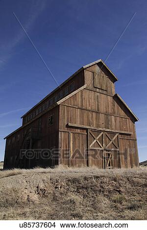 Picture - Old barn against the clear blue sky at Santa Fe; New Mexico; USA. Fotosearch