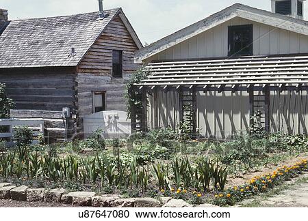 Stock Image - Old barns with farmland in foreground. Fotosearch