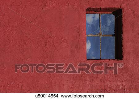 Red colored wall with clouds reflecting on window; Carrizozo; New Mexico; USA View Large Photo Image Picture - Red colored wall with clouds reflecting on window; Carrizozo; New Mexico; USA. Fotosearch