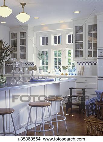 Stools at kitchen island at home View Large Photo Image Picture - Stools at kitchen island at home. Fotosearch