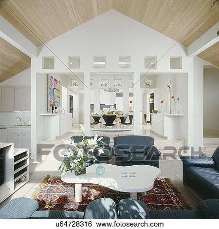 Stock Photograph - View from living area into dining and then kitchen beyond. Fotosearch