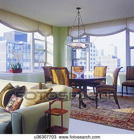 View into dining area in high rise condo; oriental rug and chandelier View Large Photo Image Stock Image - View into dining area in high rise condo; oriental rug and chandelier. Fotosearch