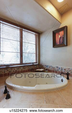 View of bath against window in the bathroom at home; Santa Fe; New Mexico; USA View Large Photo Image Stock Photography - View of bath against window in the bathroom at home; Santa Fe; New Mexico; USA. Fotosearch