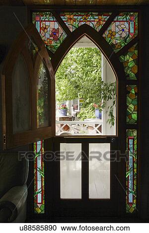 View of porch through silhouette stained glass window; Taos; New Mexico; USA View Large Photo Image Stock Image - View of porch through silhouette stained glass window; Taos; New Mexico; USA. Fotosearch