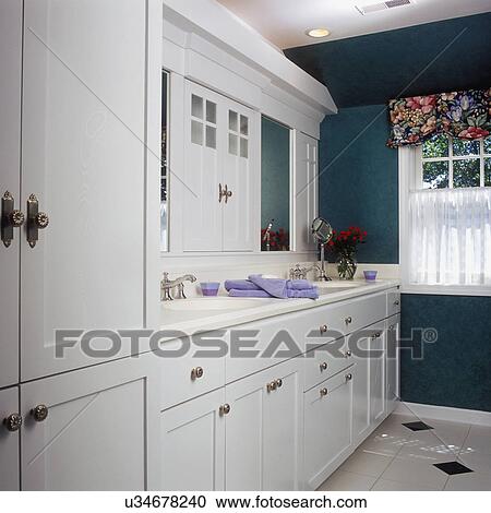 White cabinets with mirror above sinks in the bathroom View Large Photo Image Stock Image - White cabinets with mirror above sinks in the bathroom. Fotosearch