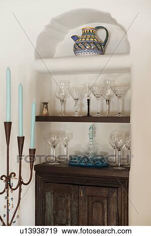 Wine glasses and jar in wall built in shelf; Santa Fe; New Mexico; USA View Large Photo Image Stock Photo - Wine glasses and jar in wall built in shelf; Santa Fe; New Mexico; USA. Fotosearch