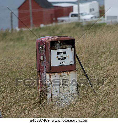 Stock Photo - Abandoned fuel pump in grass, Plate Cove East, Bonavista Peninsula, Newfoundland And Labrador, Canada. Fotosearch