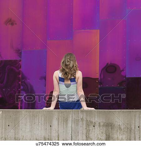 Back view of blond woman sitting in front of EMP Museum, Seattle, Washington State, USA View Large Photo Image Stock Photography - Back view of blond woman sitting in front of EMP Museum, Seattle, Washington State, USA. Fotosearch