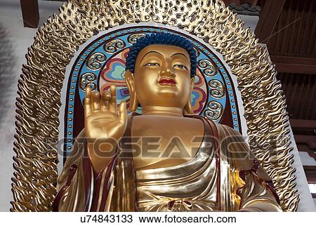 Stock Image - Blessing statue of Lord Buddha, China. Fotosearch