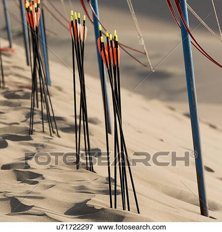 Stock Photo - Bow and arrows on sand dunes at Mingsha Shan, Dunhuang, Jiuquan, Gansu Province, China. Fotosearch