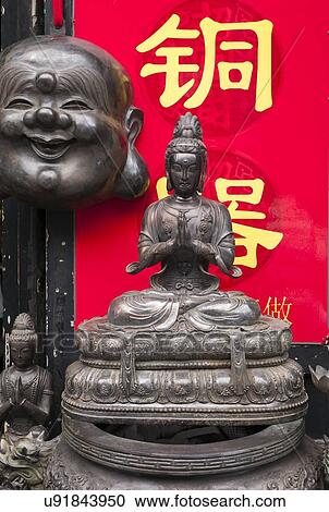 Stock Image - Buddha statues in Panjiayuan antique market, Beijing, China. Fotosearch