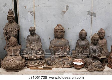 Buddha statues in Panjiayuan antique market, Beijing, China View Large Photo Image Stock Photography - Buddha statues in Panjiayuan antique market, Beijing, China. Fotosearch