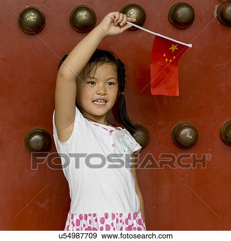Close-up of a girl holding Chinese flag at Forbidden City, Xicheng District, Beijing, China View Large Photo Image Stock Photo - Close-up of a girl holding Chinese flag at Forbidden City, Xicheng District, Beijing, China. Fotosearch