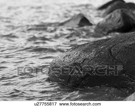 Stock Photo - Close-up of a rocks in Lake Winnipeg, Riverton, Hecla Grindstone Provincial Park, Manitoba, Canada. Fotosearch