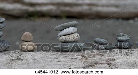 Stock Image - Close-up of stacks of stones in a row, Deception Pass State Park, Oak Harbor, Washington State, USA. Fotosearch